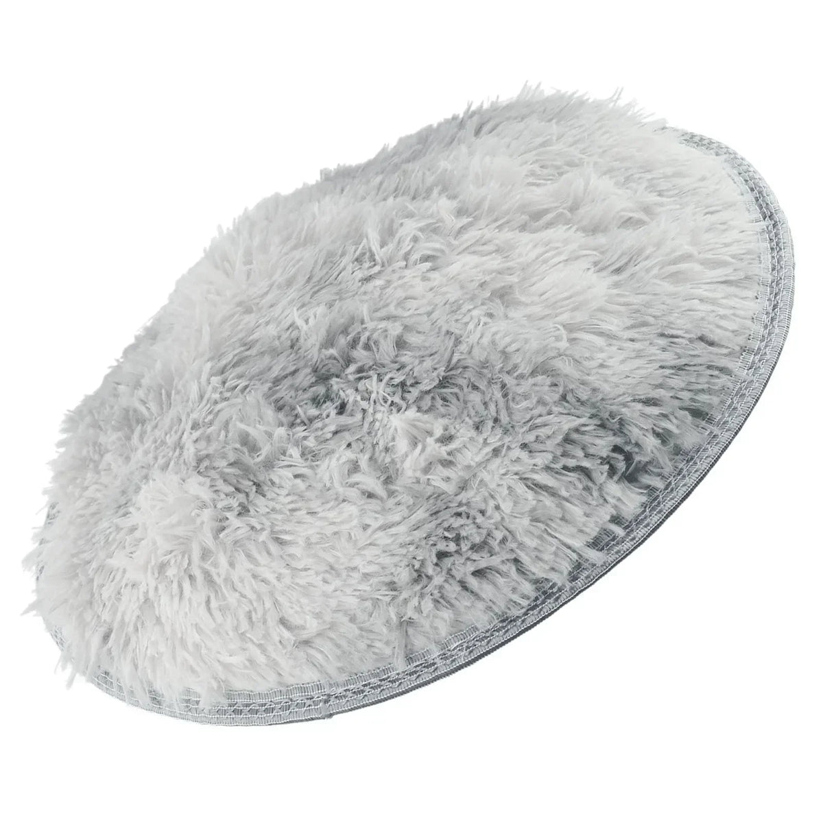 A round, fluffy gray shaggy area rug for home decor.