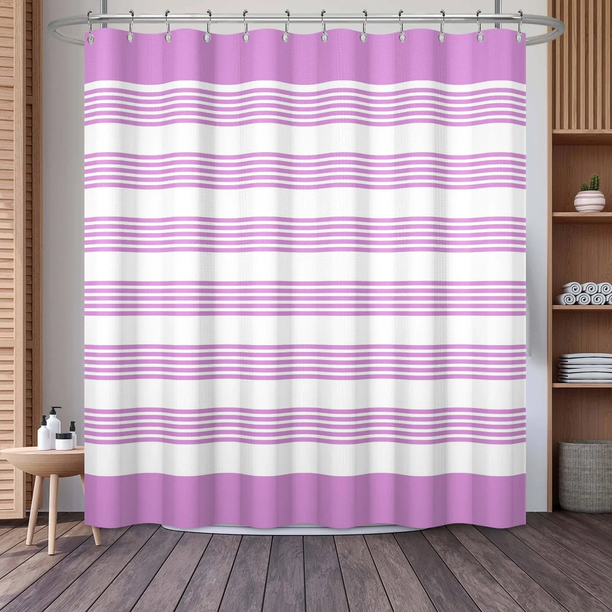 A shower curtain featuring a vertical striped pattern of pink and white horizontal stripes.