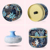 A refillable loose powder container with a gold lid and a blue floral pattern, shown in various angles.