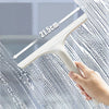 A hand is using a white multi-function window cleaning tool, showing a measurement of 21.5 cm on the handle.