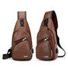 A brown leather men's crossbody sling bag with a flap and zipper details.