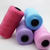 Three spools of pink, blue, and purple ice cotton silk thread for knitting and crochet