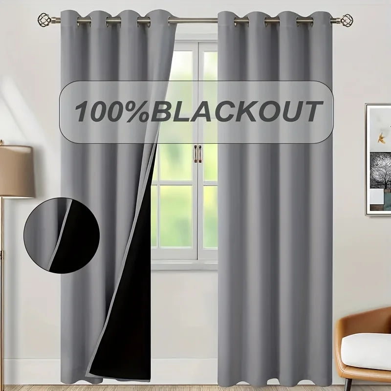 Gray blackout curtain panel hanging in a window frame with a black accent.
