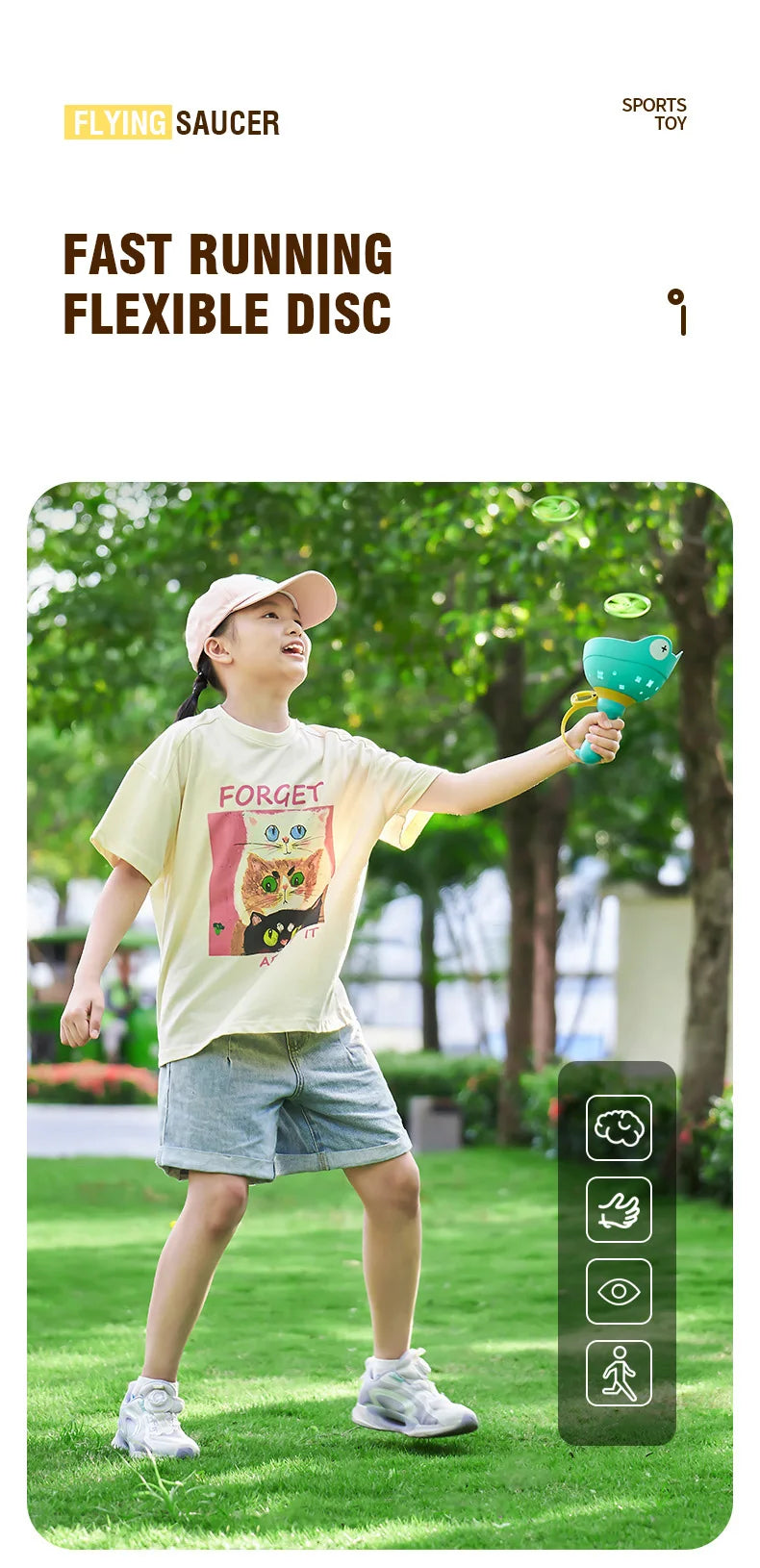A child is playing with a yellow t-shirt featuring a cat design while holding a green flying saucer toy.