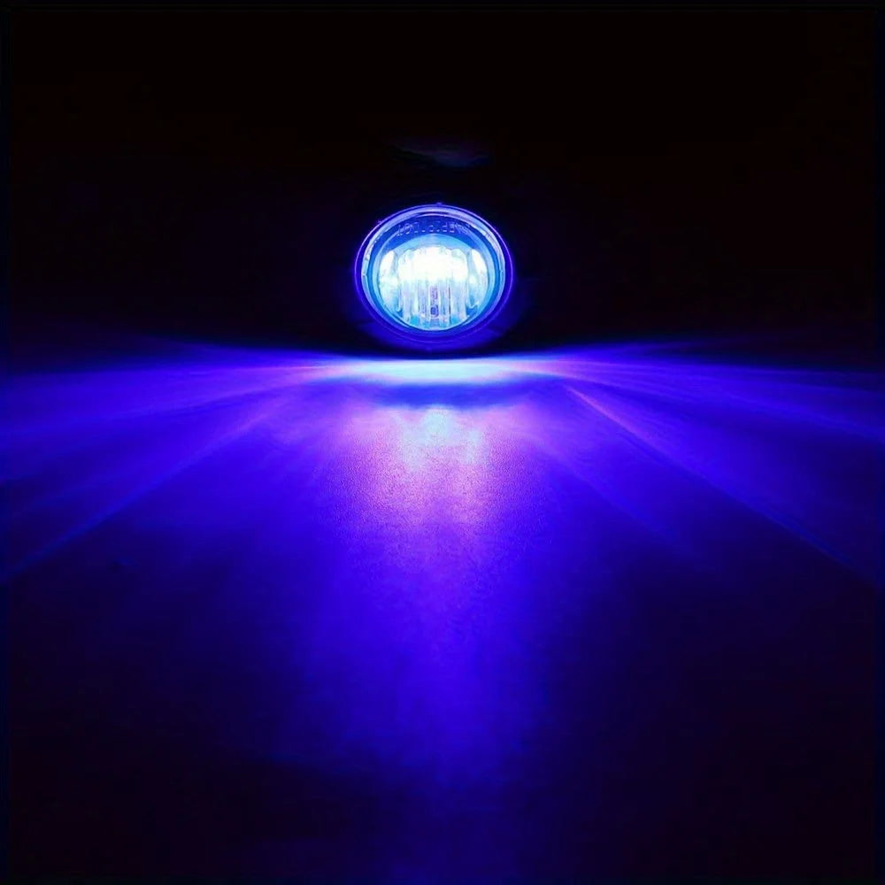A close-up view of a bright blue LED light shining forward against a dark background.