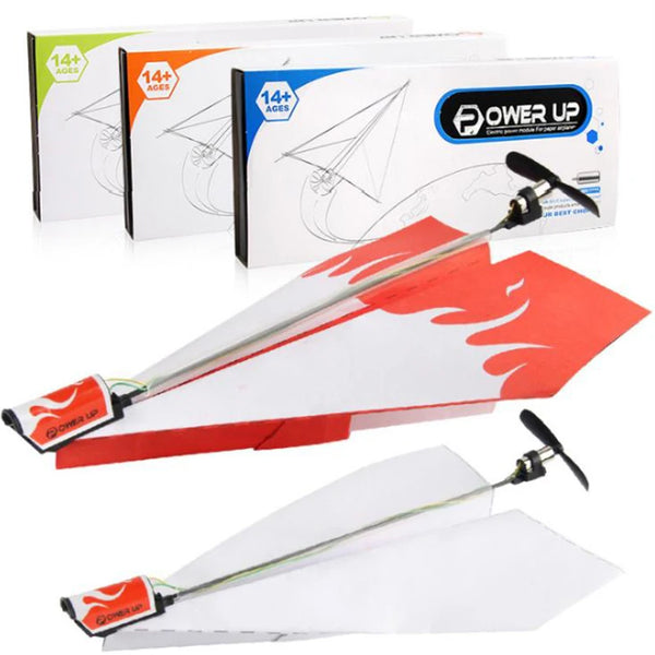 A set of DIY motorized paper airplane kits, including the plane, motor, and battery components.