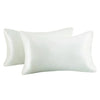 A set of two white silky satin pillowcases for hair and skin.