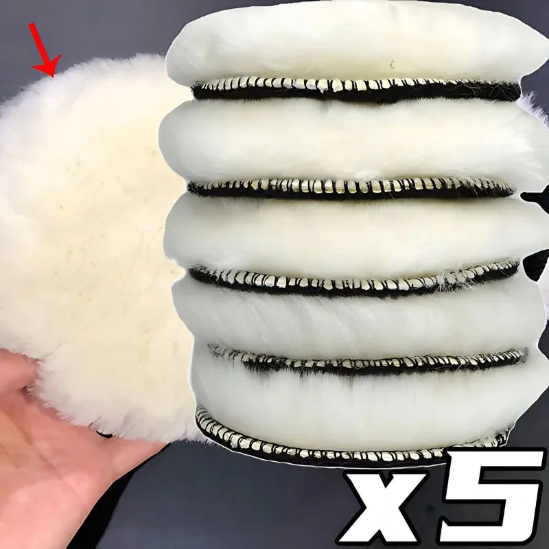 A set of five white and black wool polishing pads for car detailing.