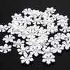 A pile of 100 white acrylic pearl spacer beads for jewelry making