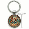 Silver key chain featuring an engraved design of the Saint Michael Archangel