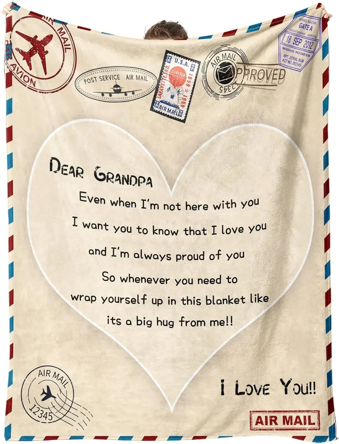 A cream colored fleece throw blanket with a heart design and text saying I love you to Grandpa