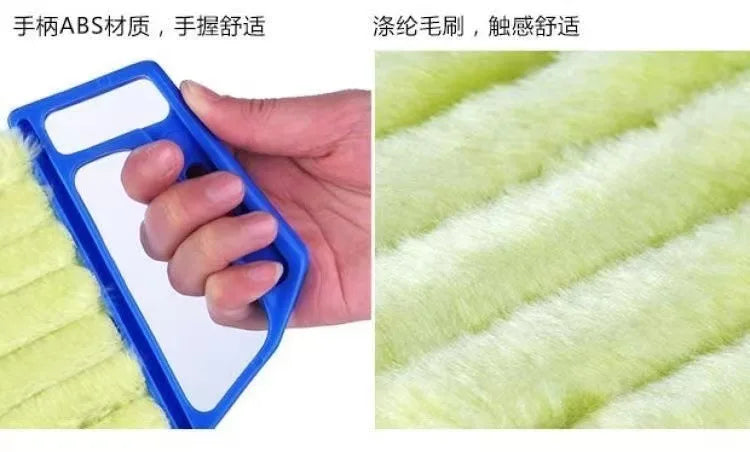A hand holds a blue plastic dusting brush against a yellow fuzzy surface, demonstrating its smooth feel.