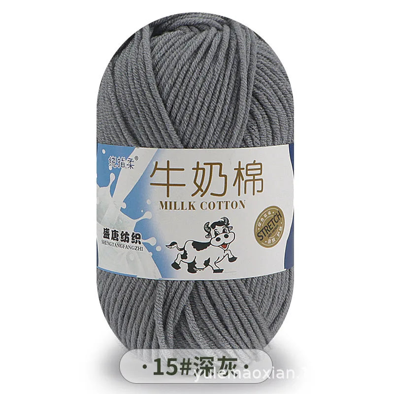 Gray milk cotton blend yarn skein with a label indicating stretch properties