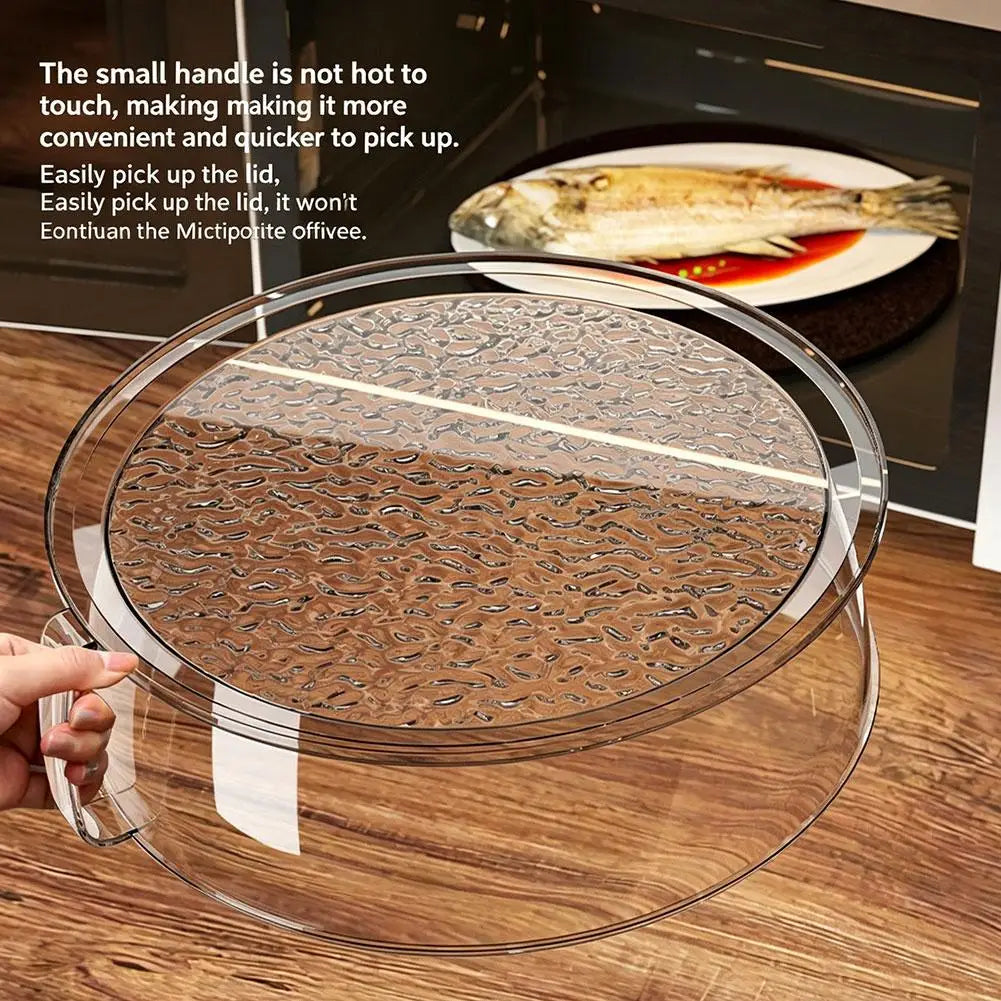 A clear microwave splatter cover with a heat-resistant handle is shown resting on a wooden surface.