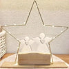 A gold wire angel-shaped mold for resin and crafting rests on a wooden base.