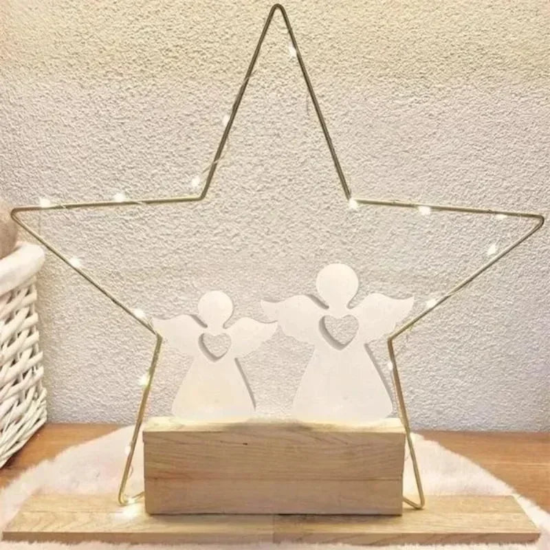 A gold wire angel-shaped mold for resin and crafting rests on a wooden base.