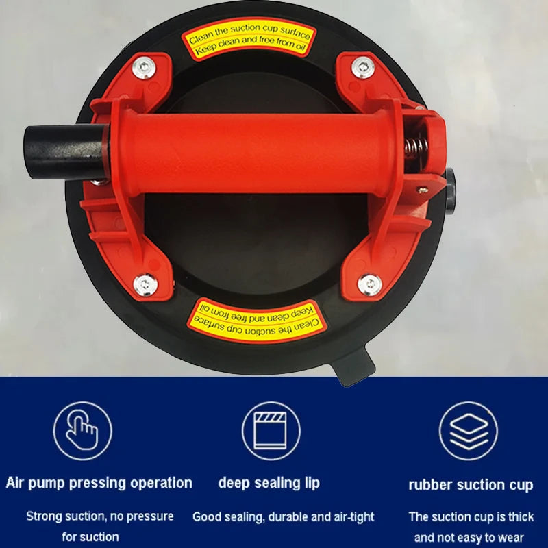 An orange suction cup lifter with a black rod and mounting hardware, designed for strong suction.