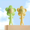 A pair of light green and yellow silicone baby teething rattles with a chewable gripper and shaker feature.