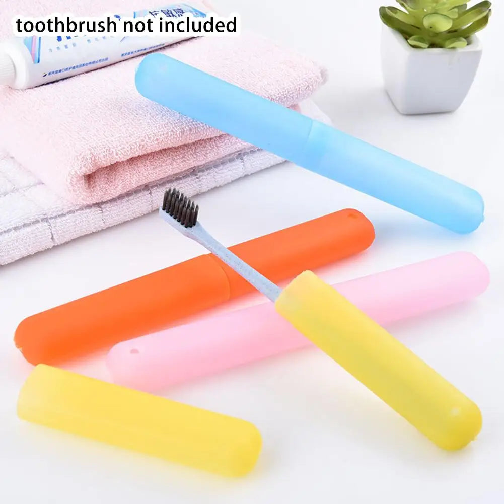 Various colored portable toothbrushes and a toothbrush not included are shown with a pink towel.