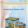 A wooden dollhouse miniature assembly kit with LED lighting displayed on a table.