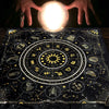 Hands holding a glowing orb above a mystical zodiac tarot tablecloth for readings and altars