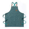 A teal canvas apron with straps and two large front pockets.