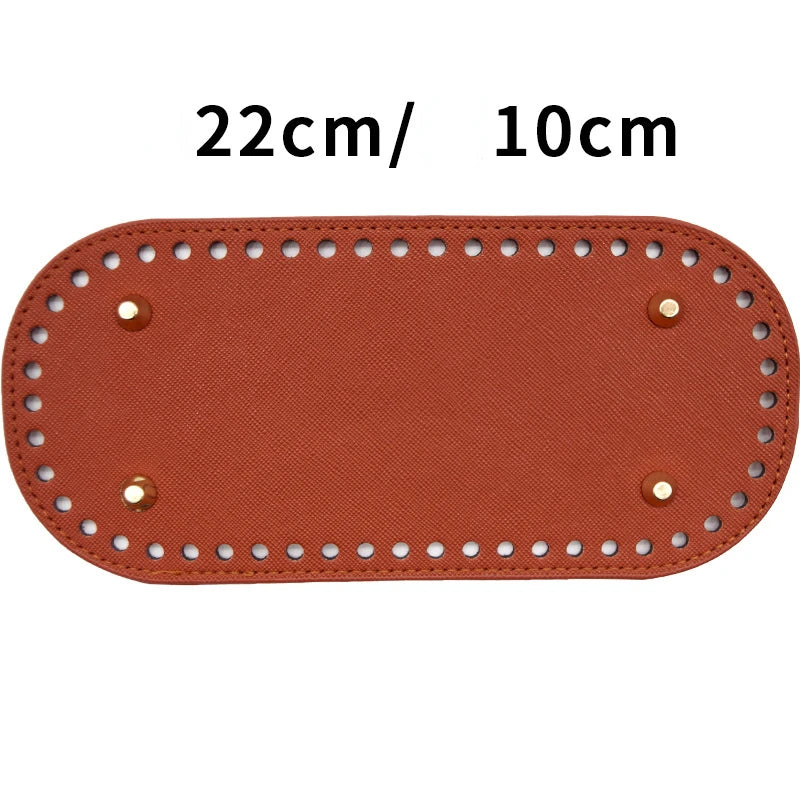 A rectangular piece of brown PU leather oval bag bottom with visible stitching and holes, measuring 22cm by 10cm.