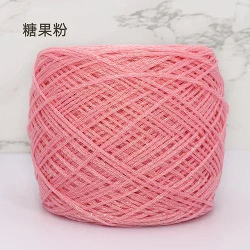 Pink metallic silk crochet yarn in a ball for knitting and macrame projects