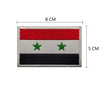 Rectangular embroidered flag patch with horizontal stripes of red, white, and black, featuring two green stars.