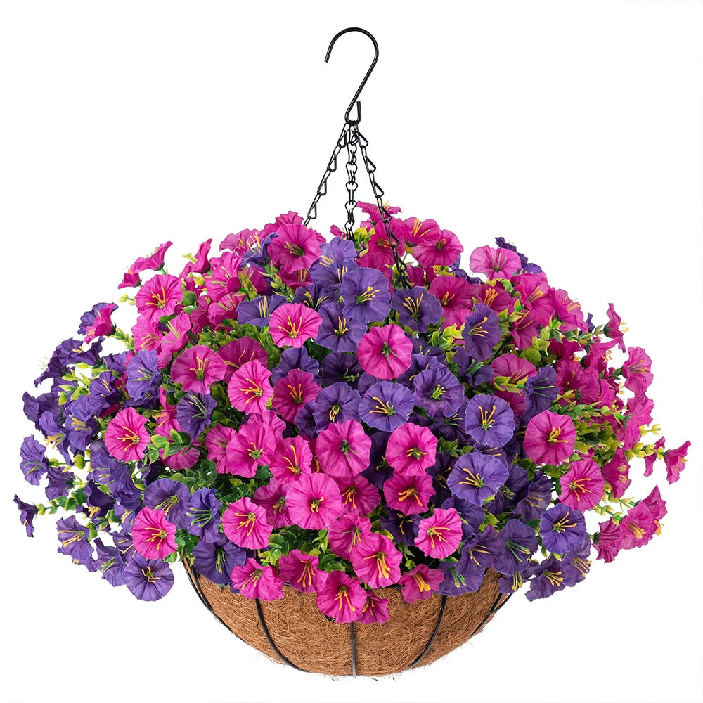 A vibrant arrangement of purple and pink artificial morning glory flowers hanging from a black hook over a woven basket.