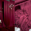 Elegant burgundy stretch jersey fabric draped as a backdrop or decor