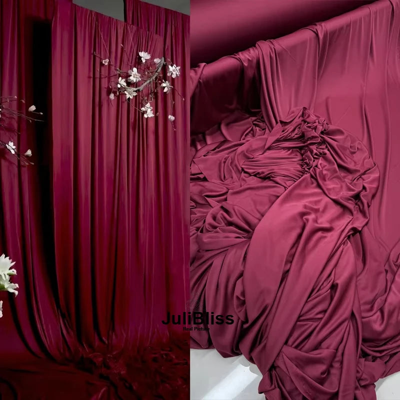 Elegant burgundy stretch jersey fabric draped as a backdrop or decor