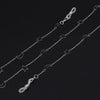 Silver chain necklace featuring a star and moon pendant design