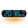 A black digital wall clock displaying the time 20:38, date, and temperature, with an orange glow.