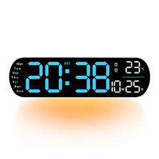 A black digital wall clock displaying the time 20:38, date, and temperature, with an orange glow.