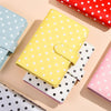 A yellow polka dot PU leather binder wallet with cash envelopes and card holder displayed on a light background.