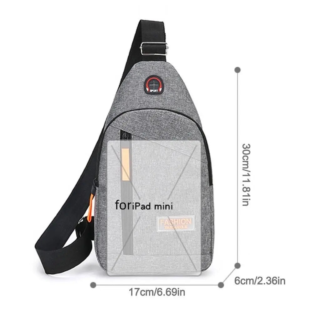 Gray fabric mini iPad bag with black strap and multiple pockets