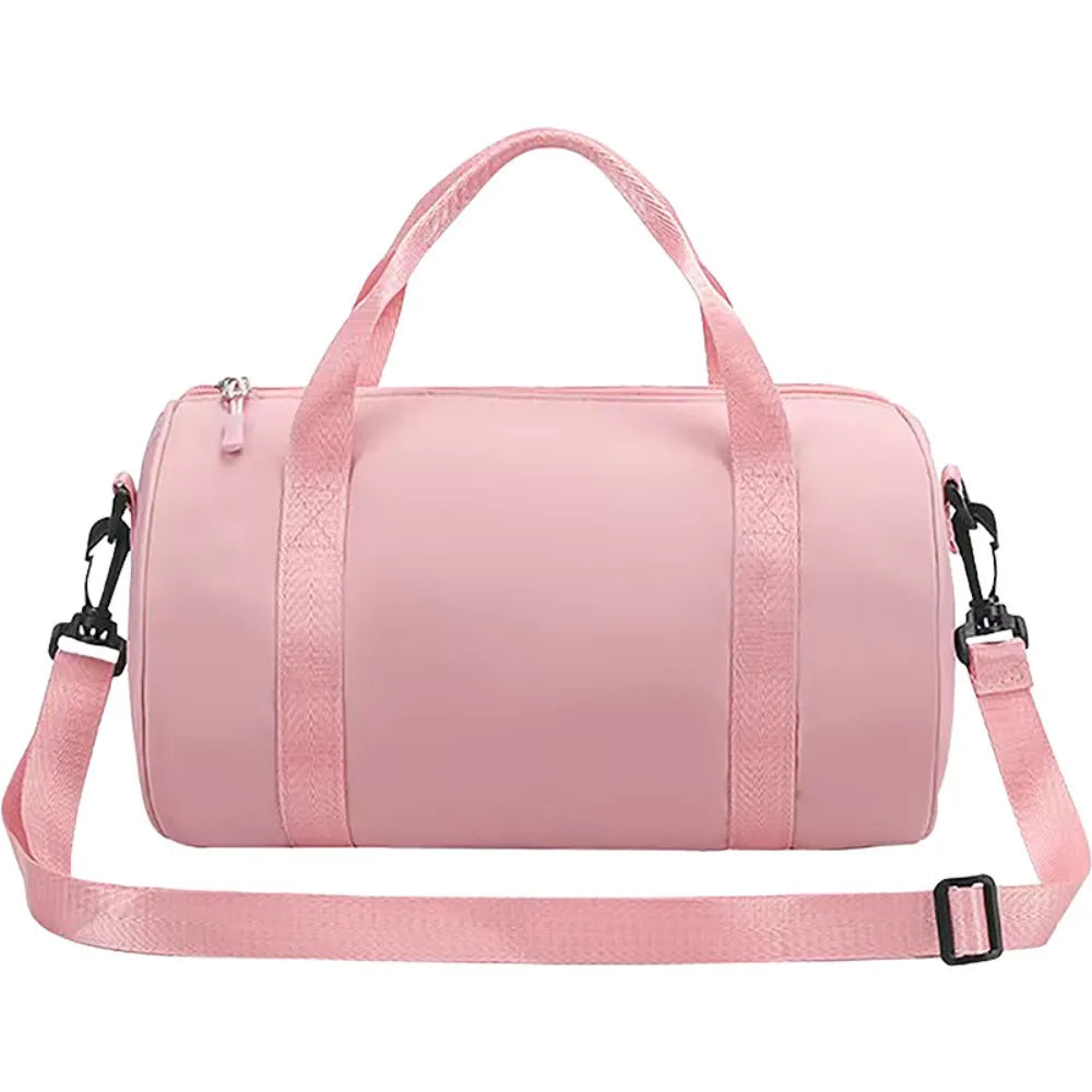 A pink compact nylon gym bag with an adjustable strap is shown.