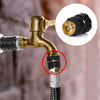 Close-up of a brass garden hose quick connector set showing the male and female parts for connection.