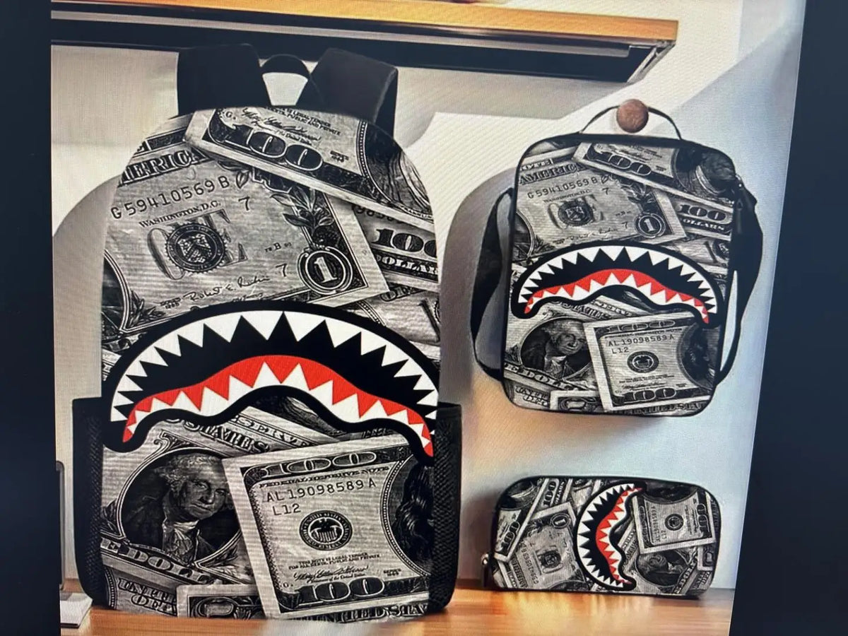 A set of backpacks featuring a shark graphic design printed on US dollar bills.