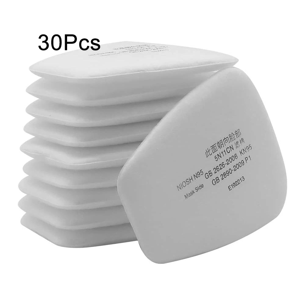 A stack of 30 replacement dust filter pads for respirators, showing the mask side.