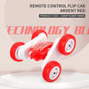 A red remote control flip car with large wheels is shown on a white surface.