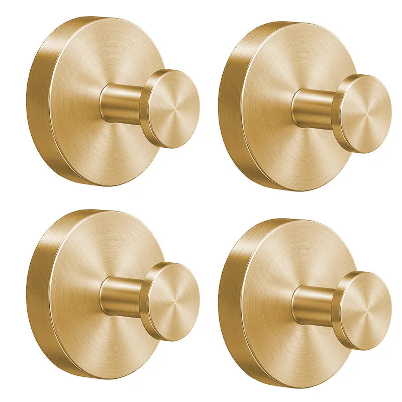 A round, brass-toned towel hook with a suction cup mount, shown in multiple angles.