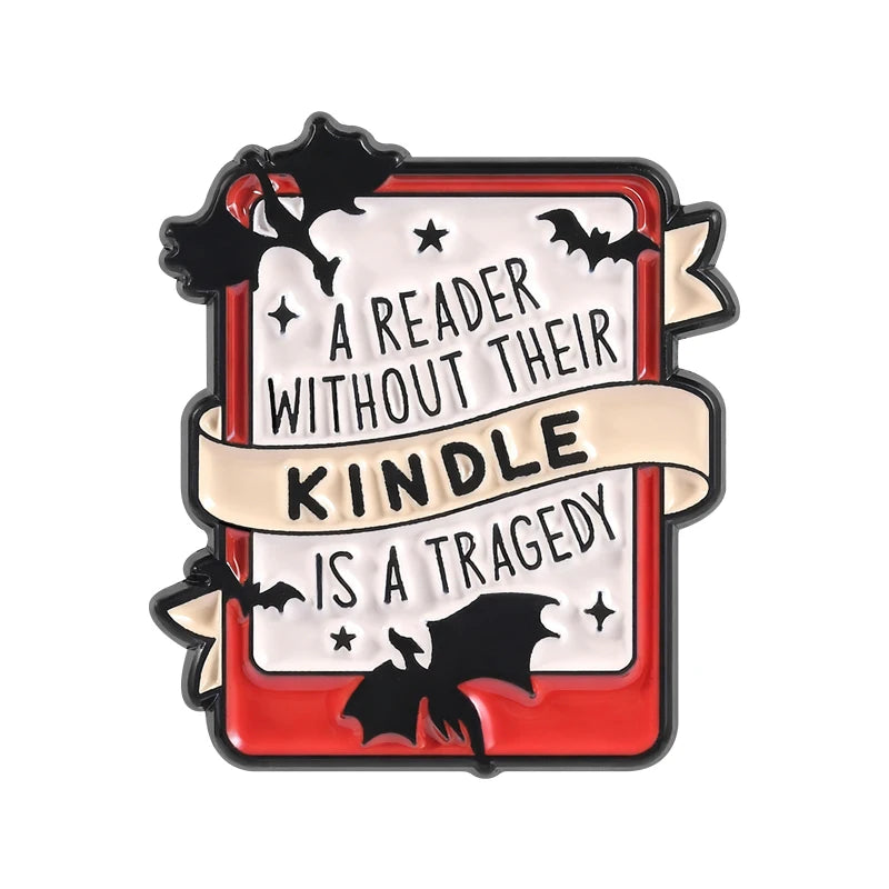 A book lover enamel pin featuring a bat silhouette and text about reading without a kindle being a tragedy