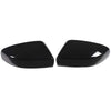 A pair of glossy black carbon fiber side mirror covers for a Maserati Ghibli or Quattroporte.