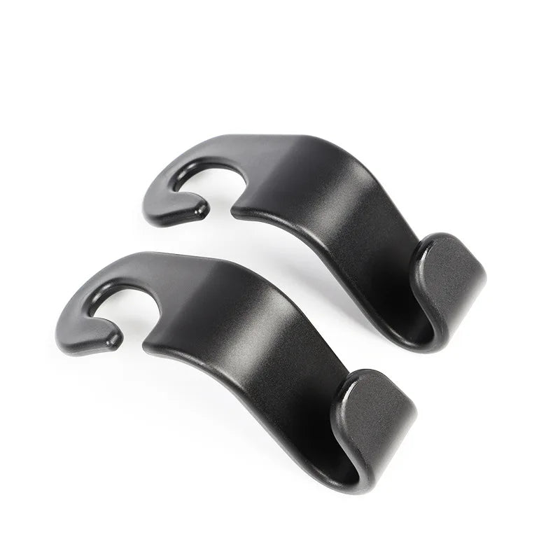 A pair of black universal car seat headrest hooks.