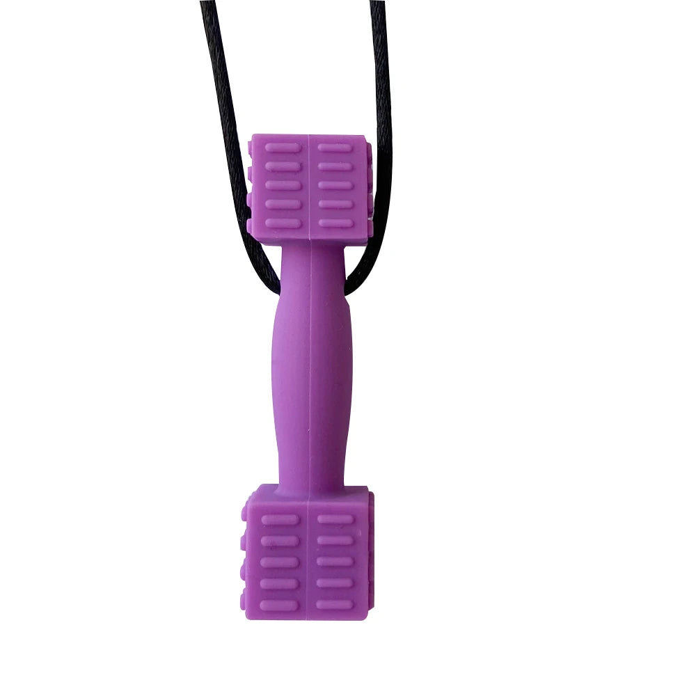 A purple silicone sensory chew necklace pendant with a black cord.