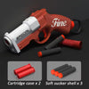 An orange and white toy gun is shown with cartridge cases and soft sucker shells.