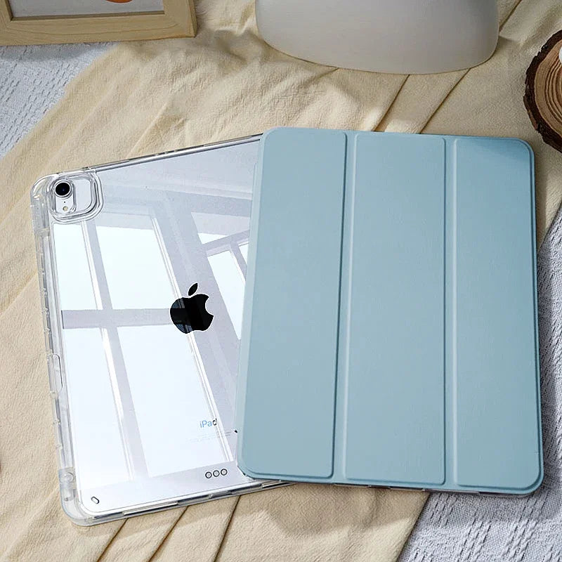 A light blue slim protective iPad case with a built-in pencil holder is shown on a beige fabric.