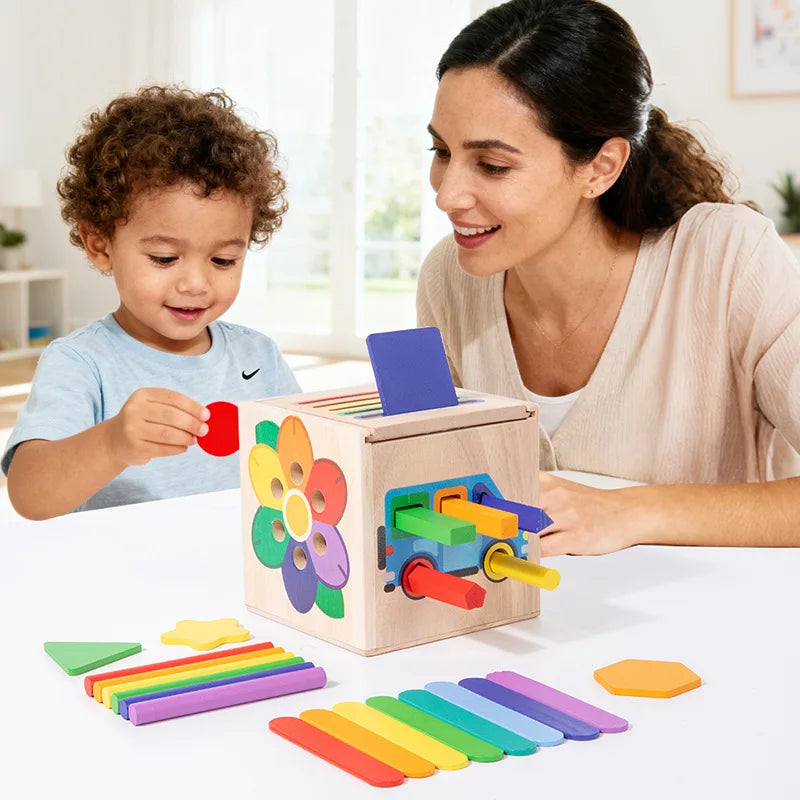 A woman and a child interact with a wooden 5-in-1 Montessori shape and color sorting toy featuring colorful wooden blocks.